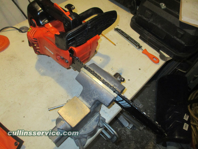 How to Sharpen a Chainsaw place chainsaw in vise Cullins Service