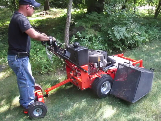 Cullins Service using the Dek Turf Beast Commercial Duty Dual Hydro Walk-Behind Finish-Cut Turf Mower with Floating Deck w/ 2 Wheel Mower Sulky and a side grass collector